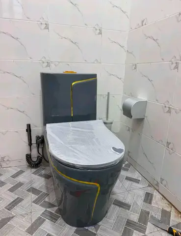 White marble bathroom with charcoal vanity — 2