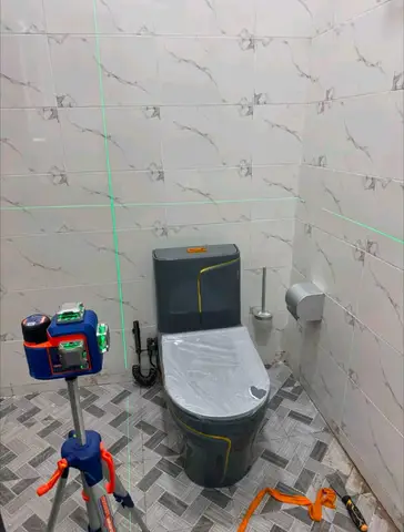 White marble bathroom with charcoal vanity — 6