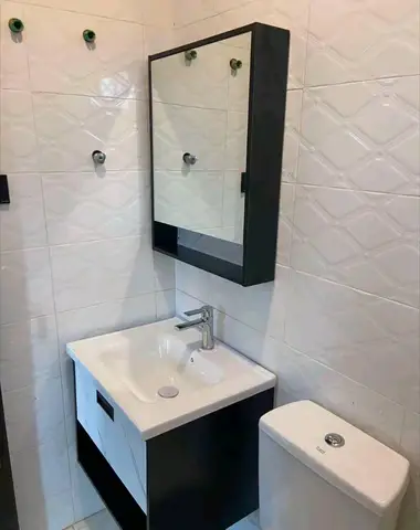 Bathrooms with black-and-white vanity units — 2