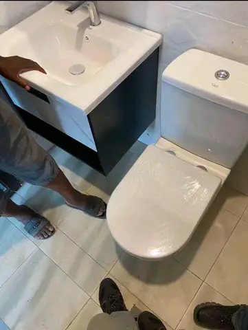 Bathrooms with black-and-white vanity units — 5