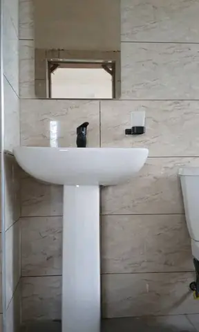 Bathrooms with black-and-white vanity units — 9