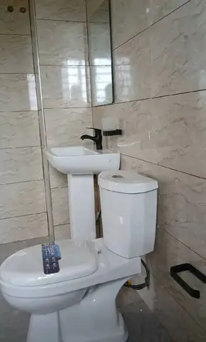 Bathroom with white 3D wall tiles — 3