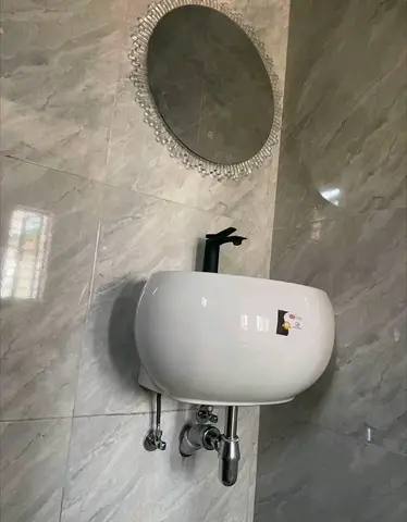Beige bathroom with black thermostatic shower — 2