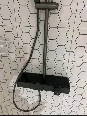 Beige bathroom with black thermostatic shower — 4