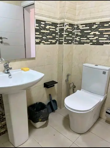 Beige bathroom with black thermostatic shower — 10